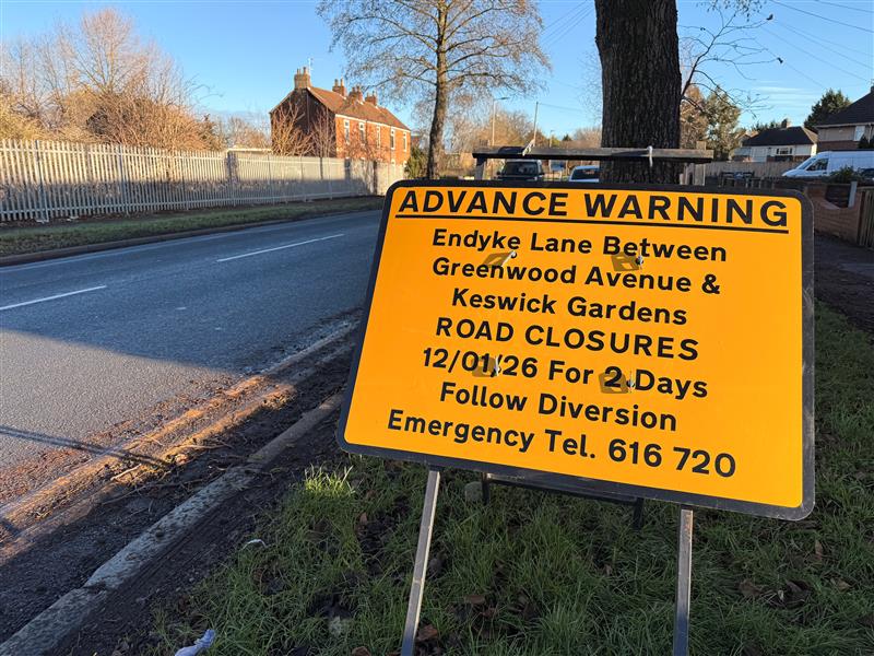 A road sign informing motorists and members of the travelling public about upcoming road works to improve an area of road between Cottingham Road, Endyke Lane and Hall Road.