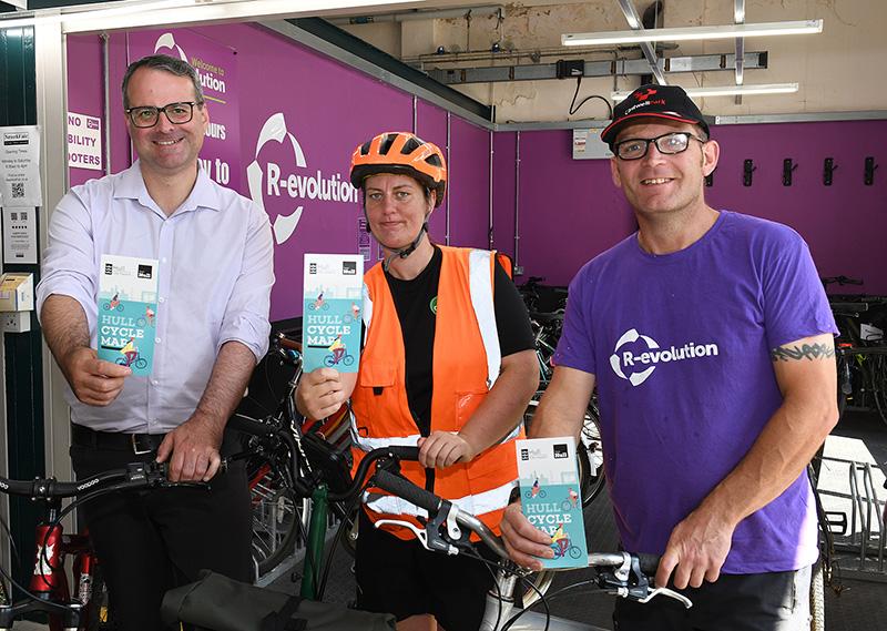 Councillor Mark Ieronimo of Hull City Council, Rebecca Rose from First Step Sports and Barry Steward of R-evolution with copies of the new cycle map for Hull.
