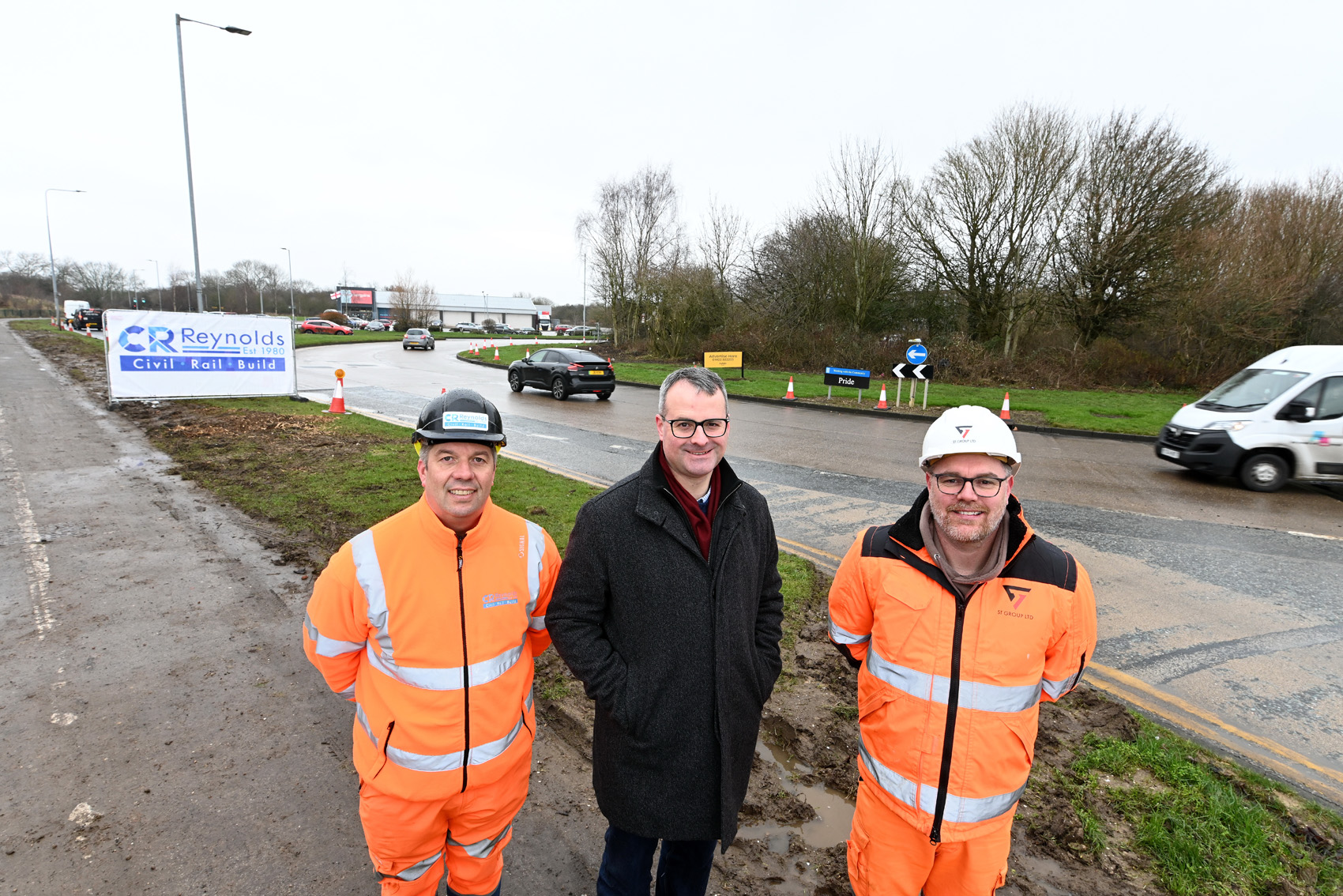 Hull City Council portfolio holder for transport and infrastructure, Councillor Mark Ieronimo (centre), with Dan Hughes, project manager for CR Reynolds Ltd (left), and Ben Owen, site supervisor (right), at the Wawne Road/Bude Road roundabout