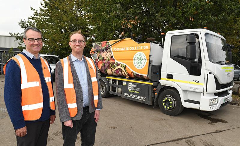 Councillor Mark Ieronimo, cabinet portfolio holder for transport and infrastructure at Hull City Council, and Councillor Quinn, portfolio holder for environment at Hull City Council, with the new fully electric food waste collection vehicle