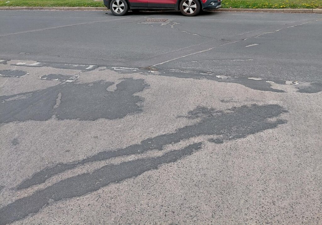 The current road surface on Falkland Road which will be resurfaced this month.