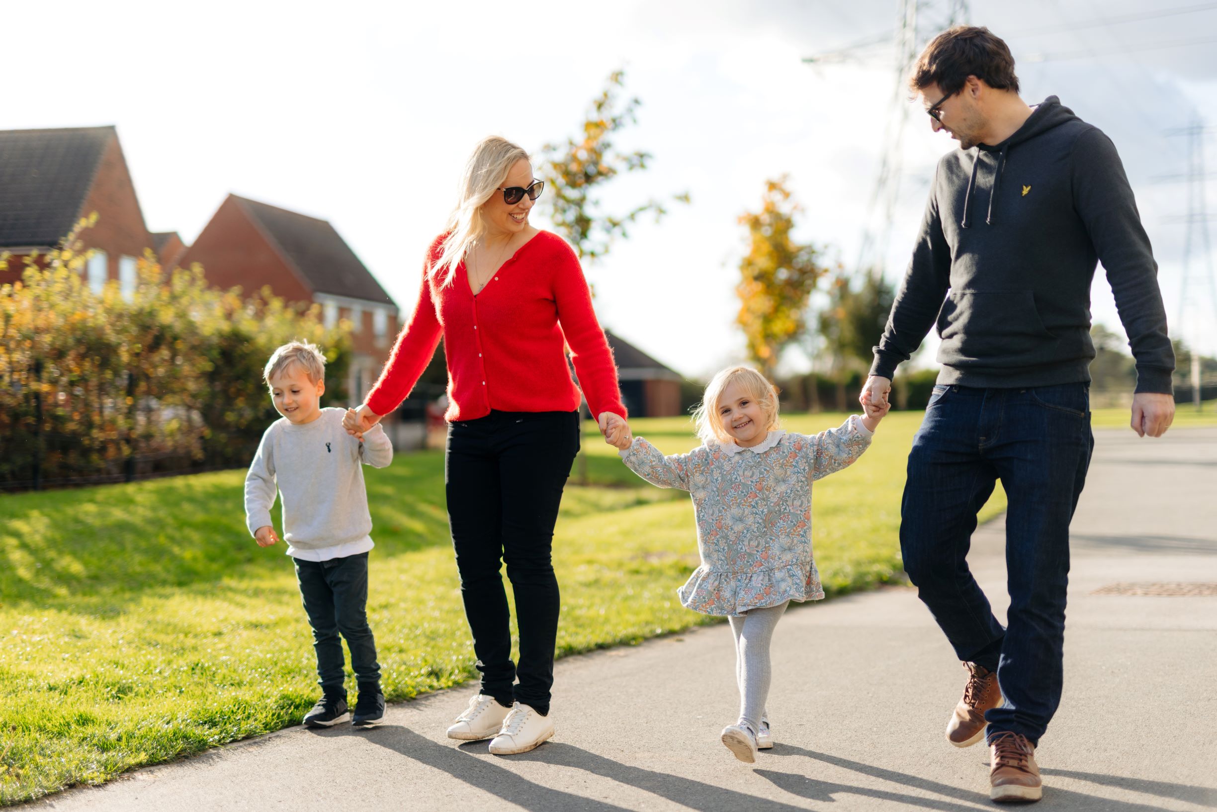 A photo of a young family walking hand-in-hand in Kingswood, Hull.