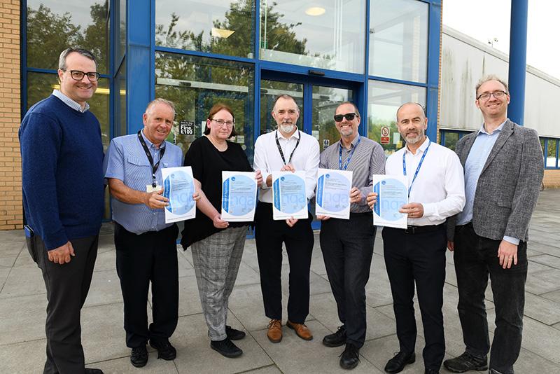 Councillor Mark Ieronimo (left) and Councillor Charles Quinn (right) with staff from the council's Streetscene Services