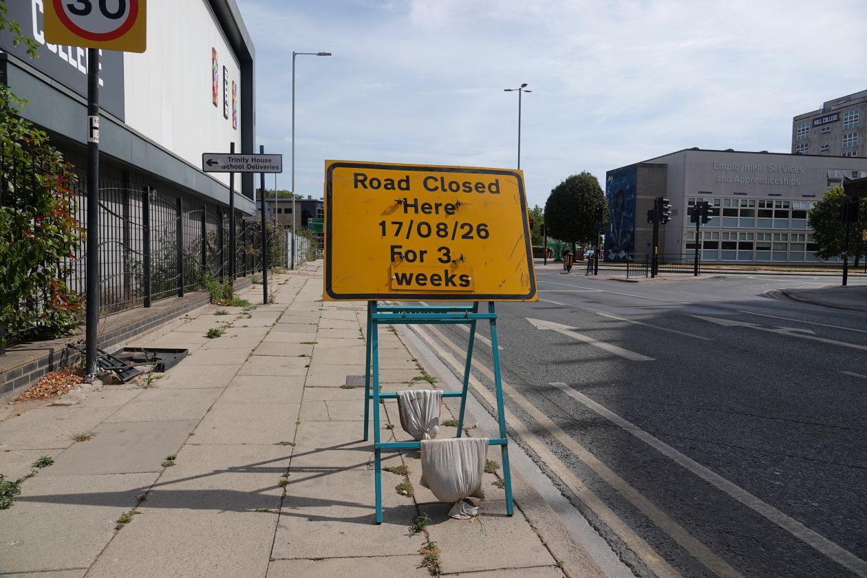 A road sign promoting a road closure on George Street.