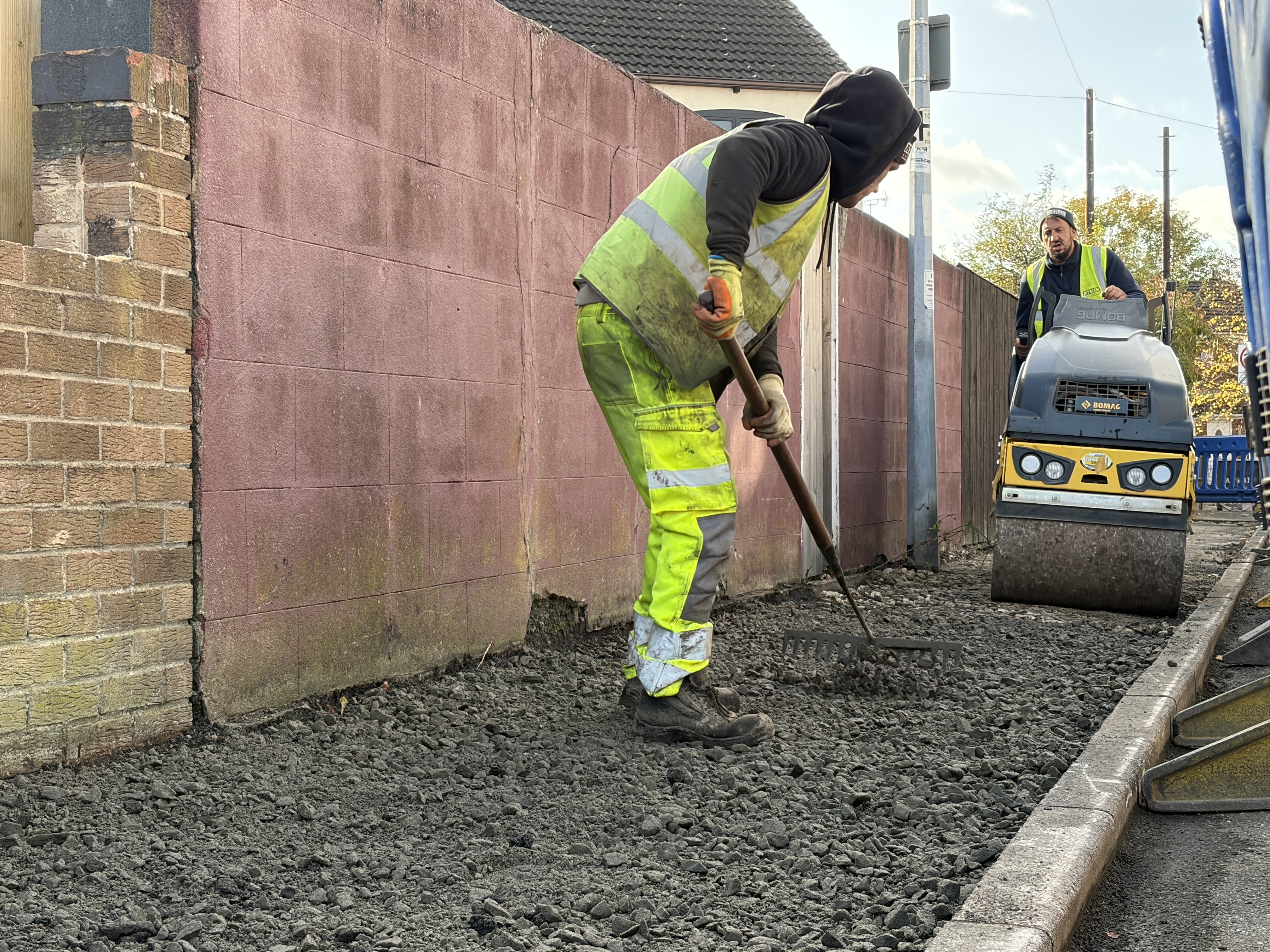 Workers resurfacing a footway in Hull