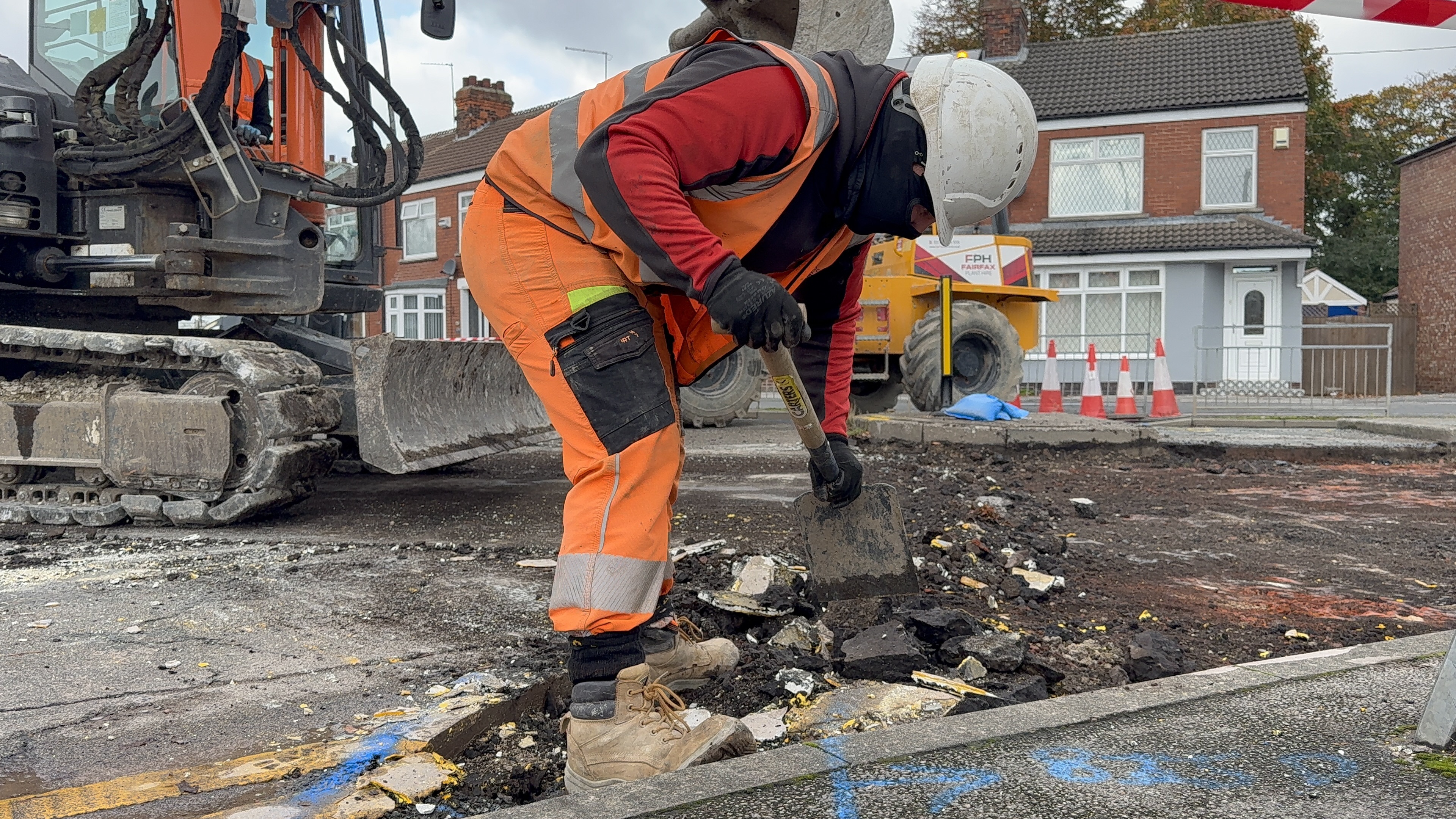 A highway worker resurfacing James Reckitt Avenue in Hull