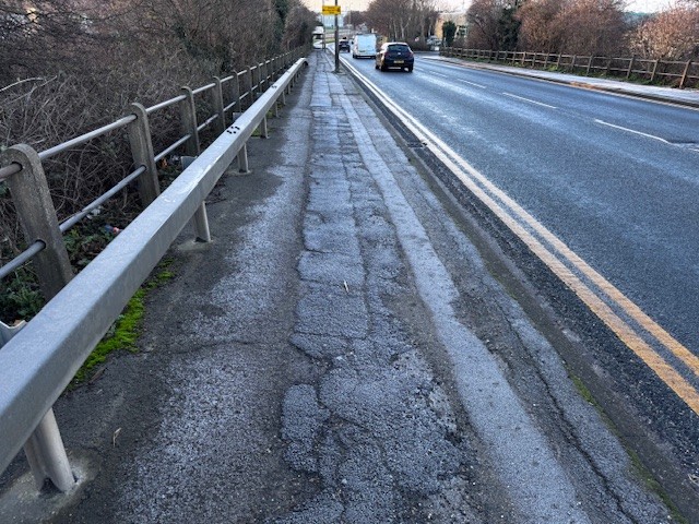 A photo of the current condition of the footpath in Marfleet Lane, which will be resurfaced.