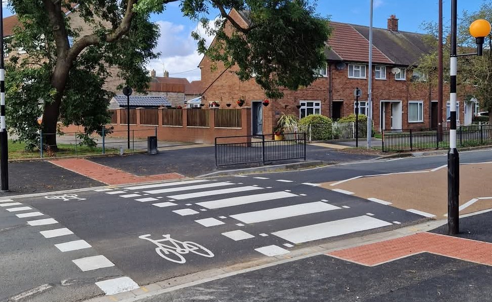 A pedestrian and cyclist crossing