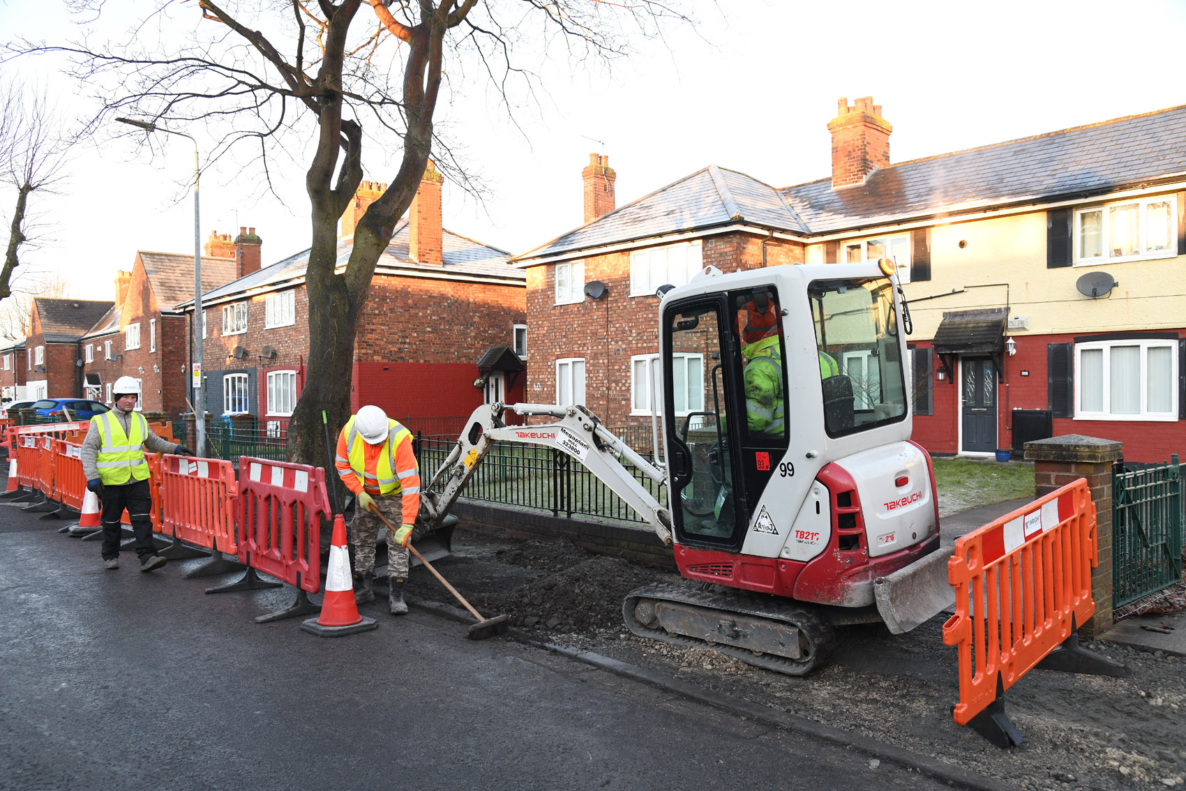 Highway workers repairing the footpath in River Grove, Hull.