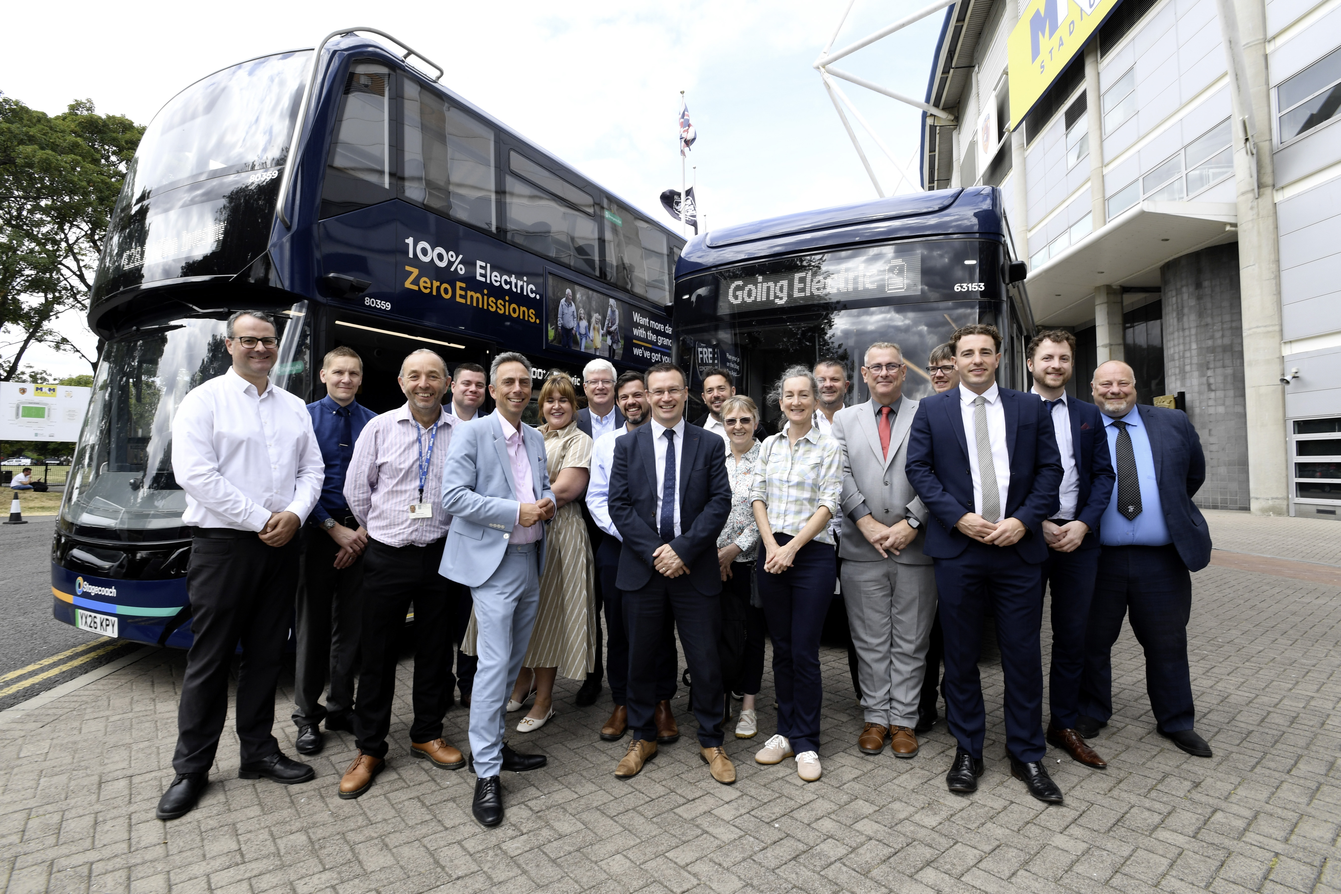 Dignitaries from Stagecoach East Midlands, Hull City Council and East Riding of Yorkshire Council with some of the operator's new electric buses outside the MKM Stadium in Hull.