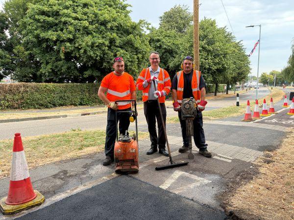 Councillor Mark Ieronimo (centre) with two members of the Highways